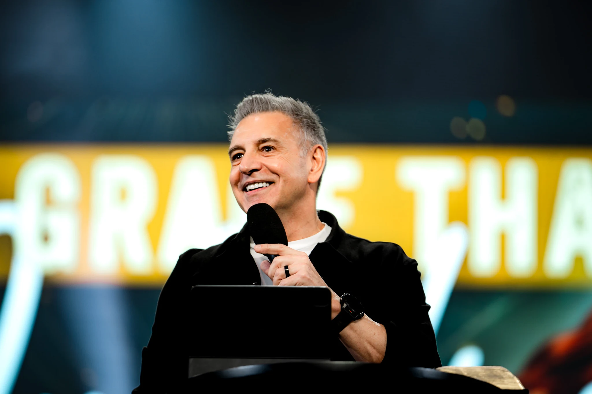 John Torrens speaking on stage