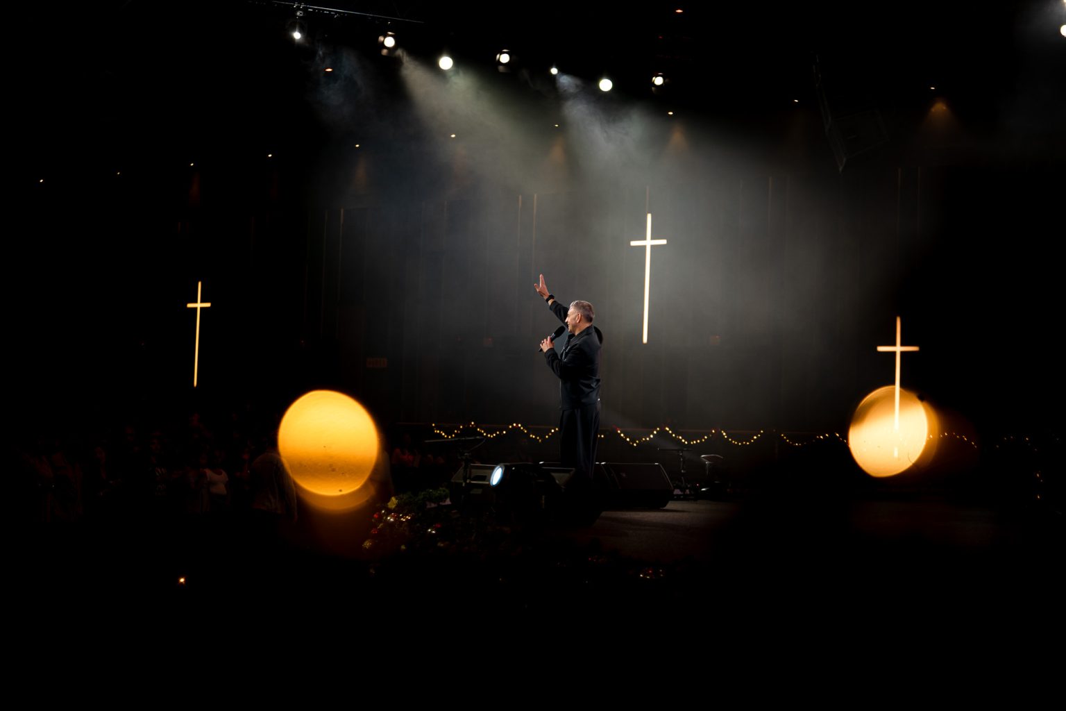 John Torrens speaking on stage